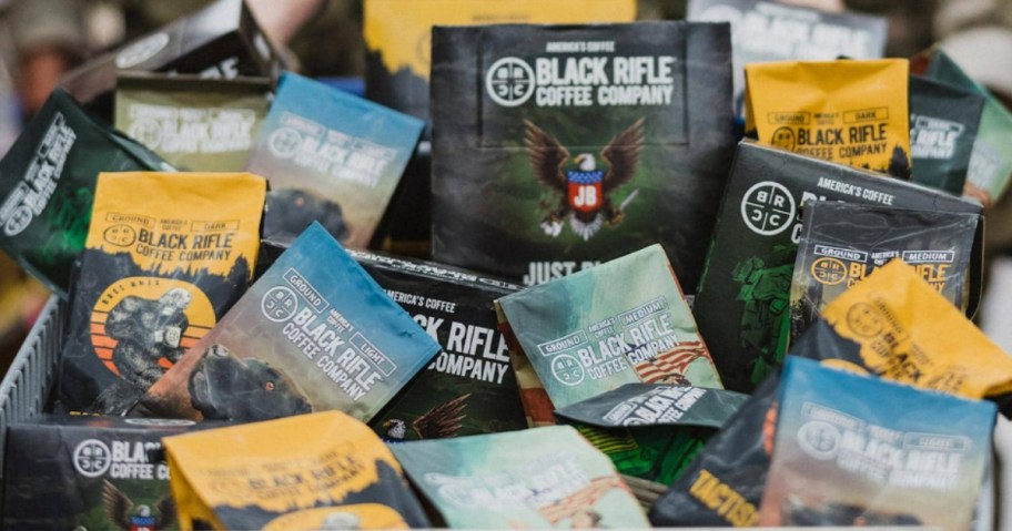 various Black Rifle Coffee company coffee bags in a bin