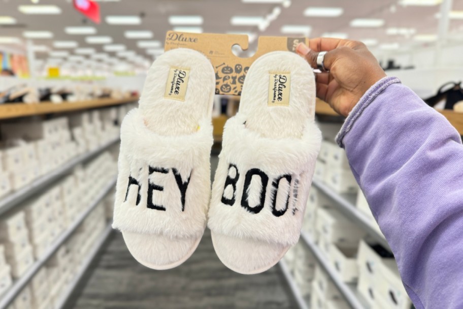 Dearfoarm halloween slippers from target with the words "hey boo" embroidered on the front