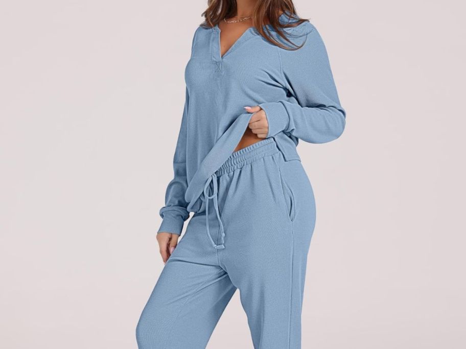 A woman in a 2-piece lounge set in blue