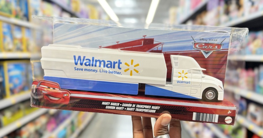 hand holding up the box for a Walmart truck toy