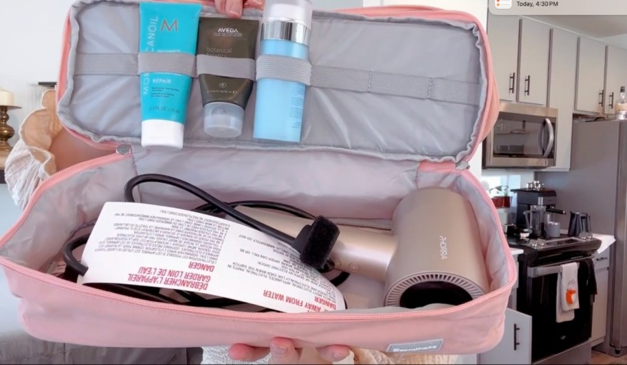 double layer travel case with hair products and styling tool