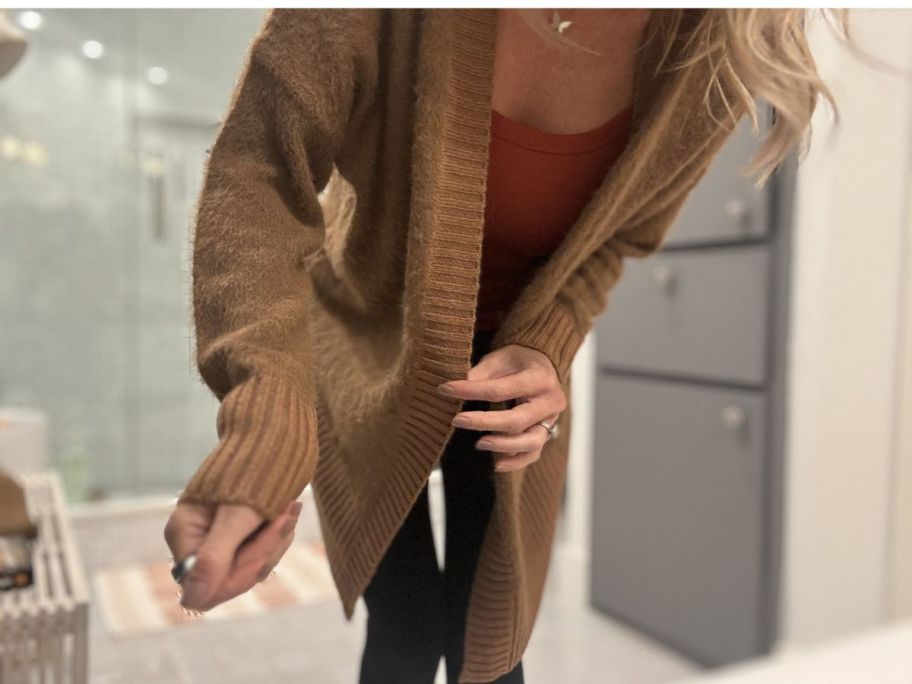 woman wearing brown cardigan