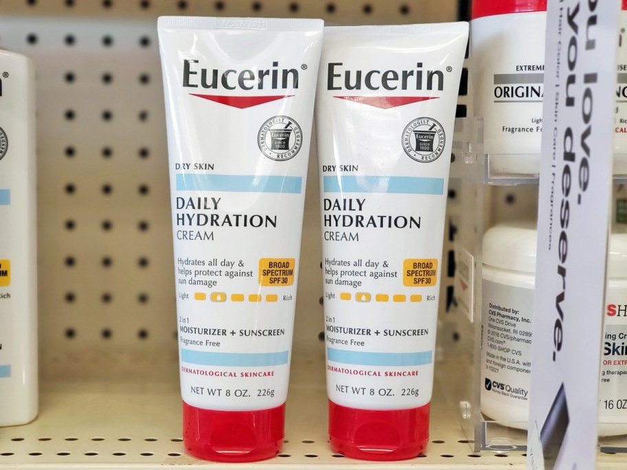 two tubes of Eucerin Daily Hydration SPF 30 Sunscreen Body Cream on store shelf