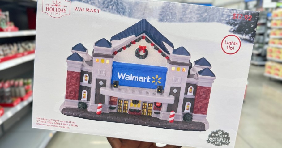 hand holding a box with a Walmart Store Holiday Village piece