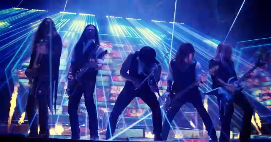 men playing guitars on stage with laser lights around them as part of the Trans-Siberian Orchestra sow