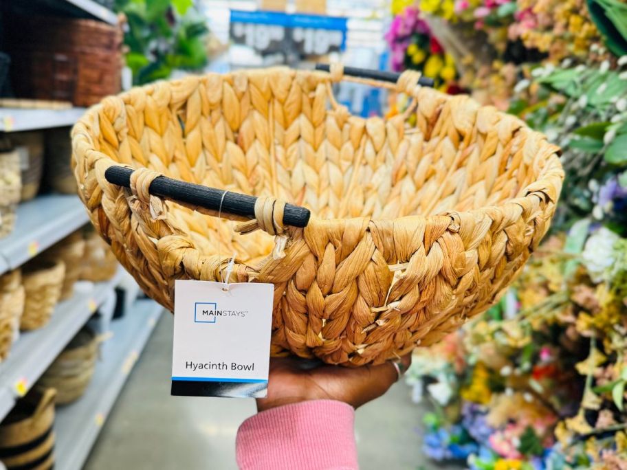 Mainstays Natural Woven Water Hyacinth Decorative Bowl in hand in store