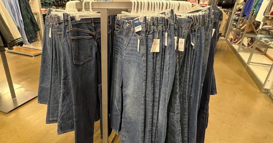 A rack of jeans hanging at Old Navy