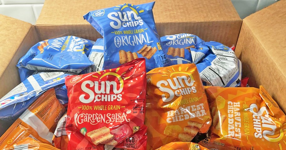 cardboard box full of small bags of SunChips in 3 different flavors