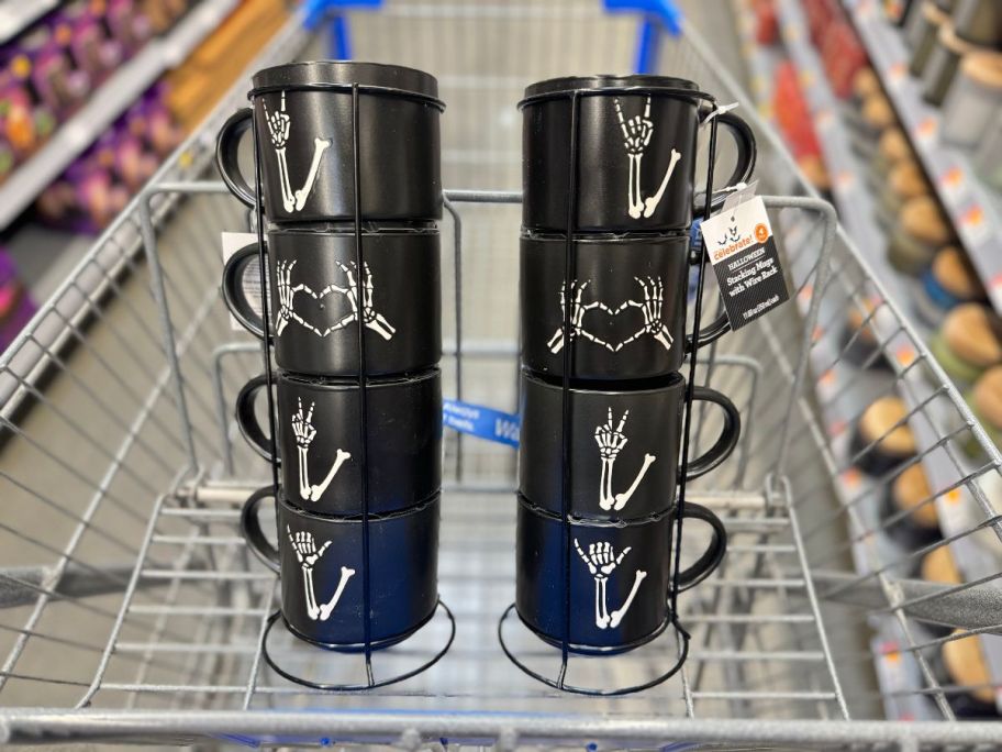 2 stacks of Black Skeleton Hand Stoneware Stackable Mugs in a cart