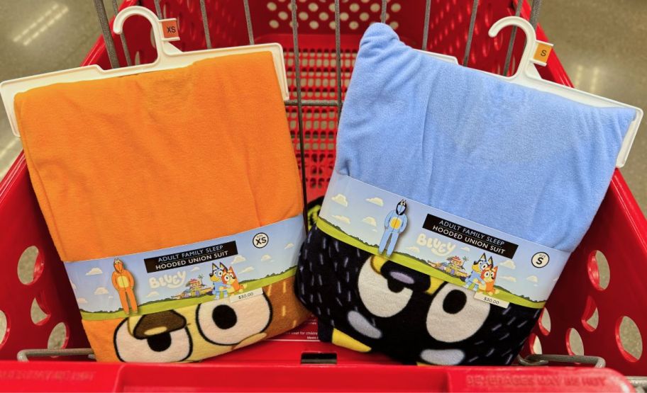 a chili and bluey adult family matching blanket sleepers in a target cart. 