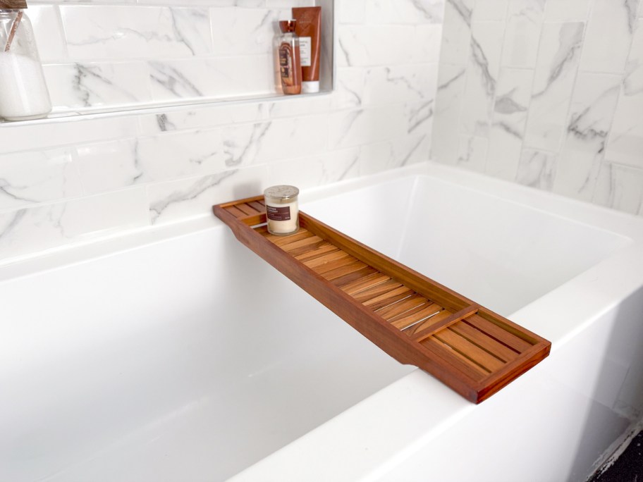 wooden bathtub tray on white bathroom