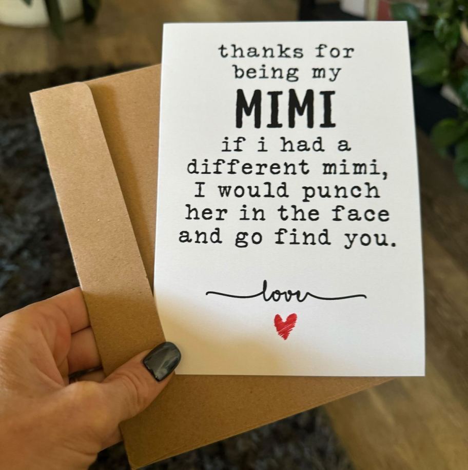 hand holding a mimi birthday card