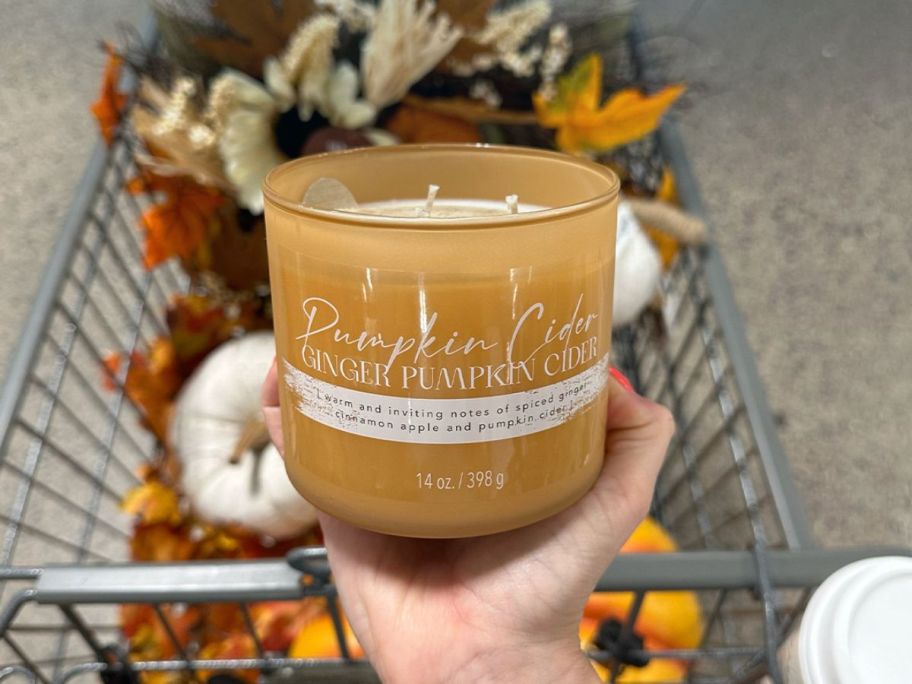 candle in hand in store