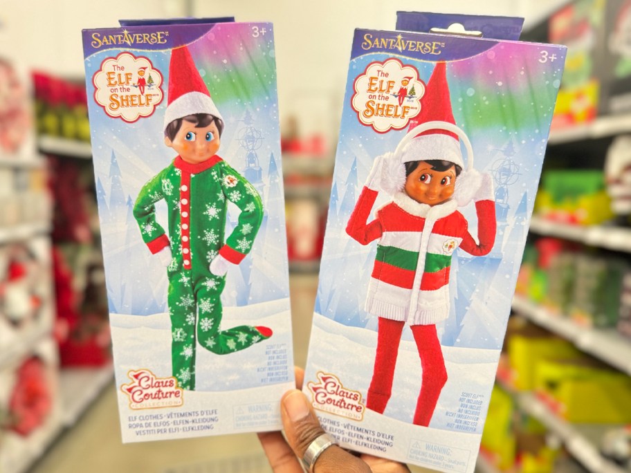 hand holding elf on shelf pjs and puffer vest outfits 