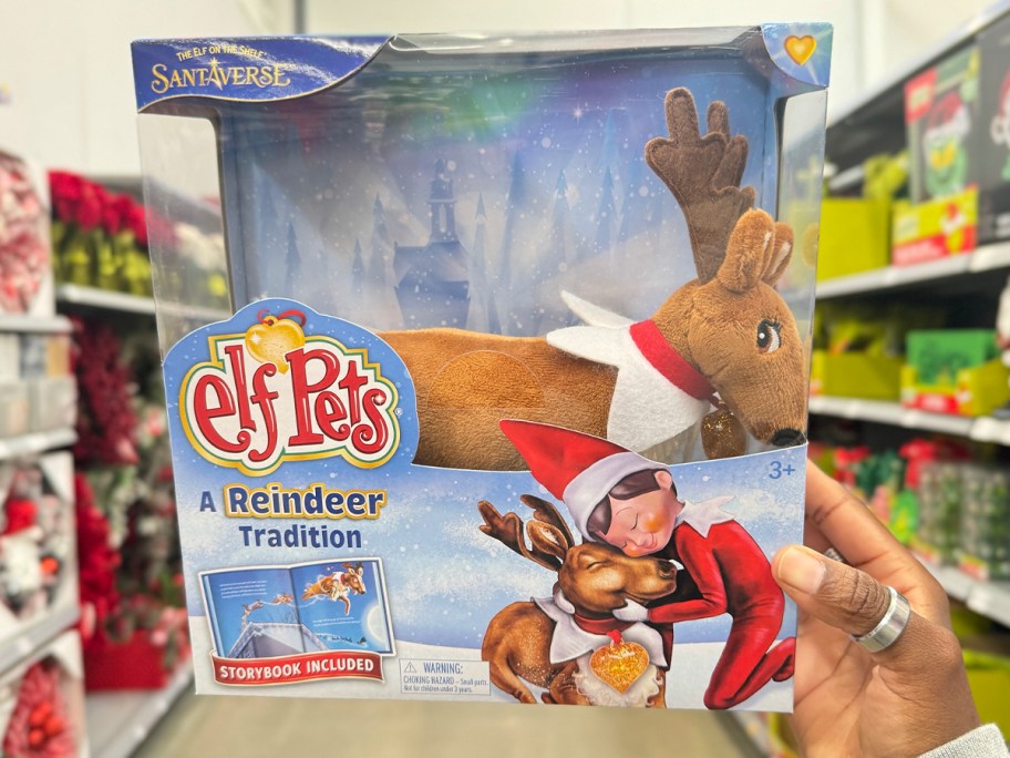 hand holding elf on shelf reindeer box