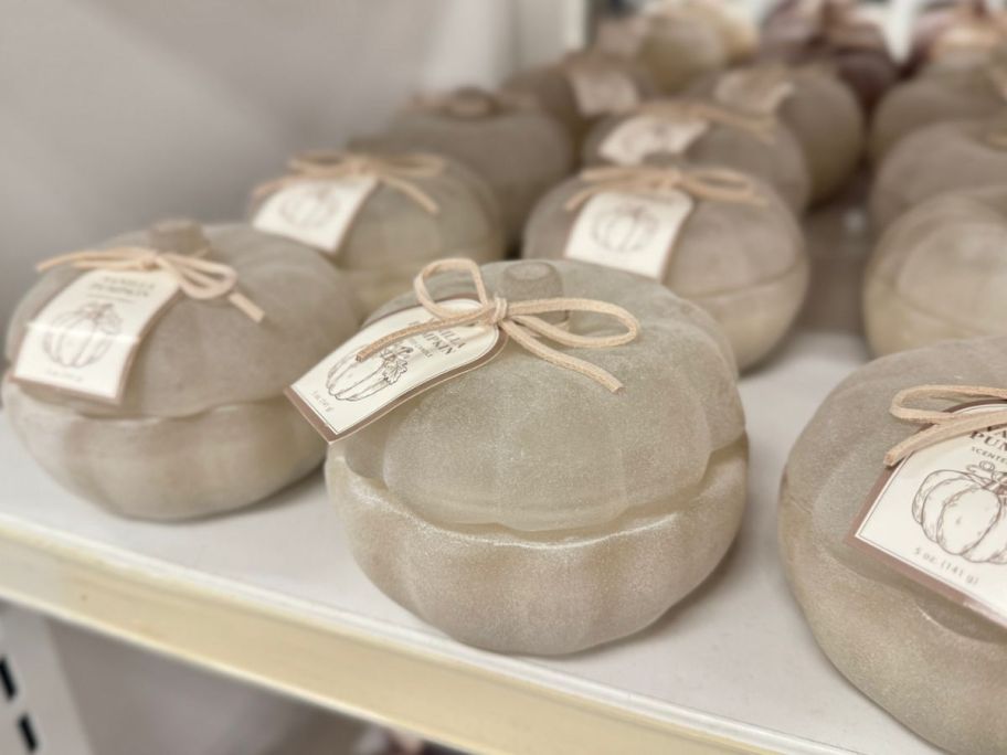 frosted vanilla pumpkin candle displayed on a shelf