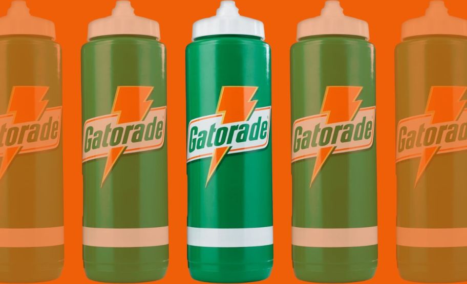 a green squeeze bottle on an orange background