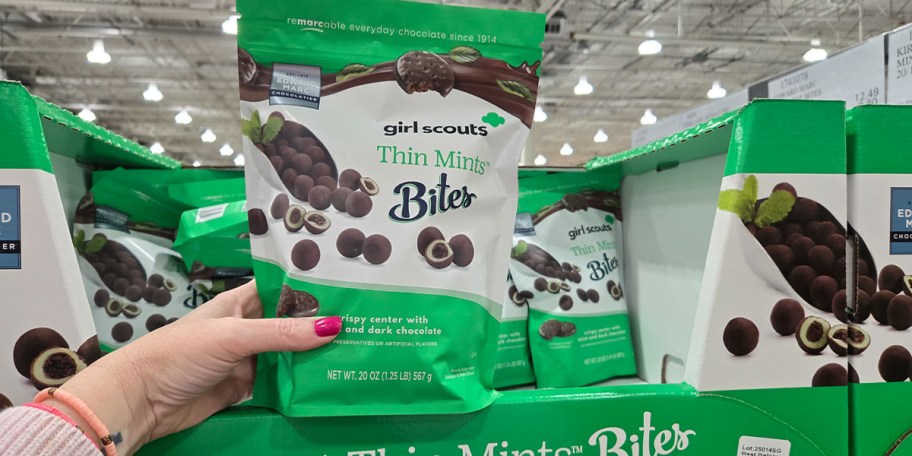 hand holding bag of girl scouts thin mints bag 