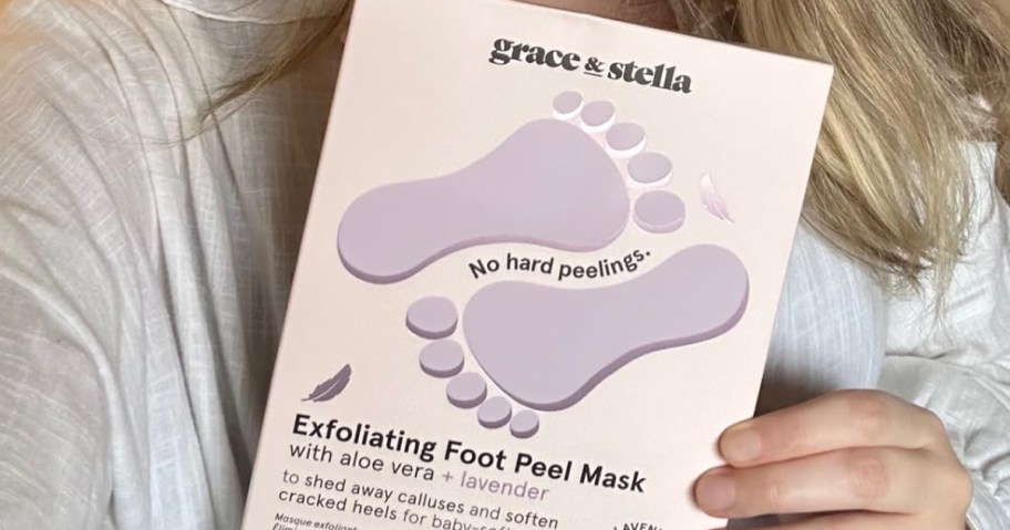hand holding grace stella foot masks