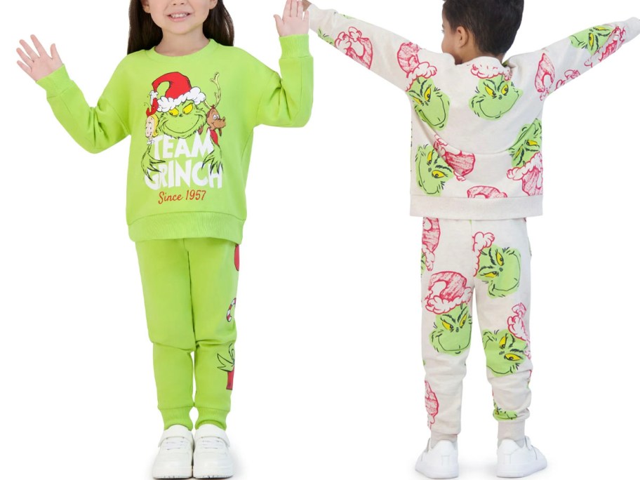 two toddlers wearing grinch jogger sets 