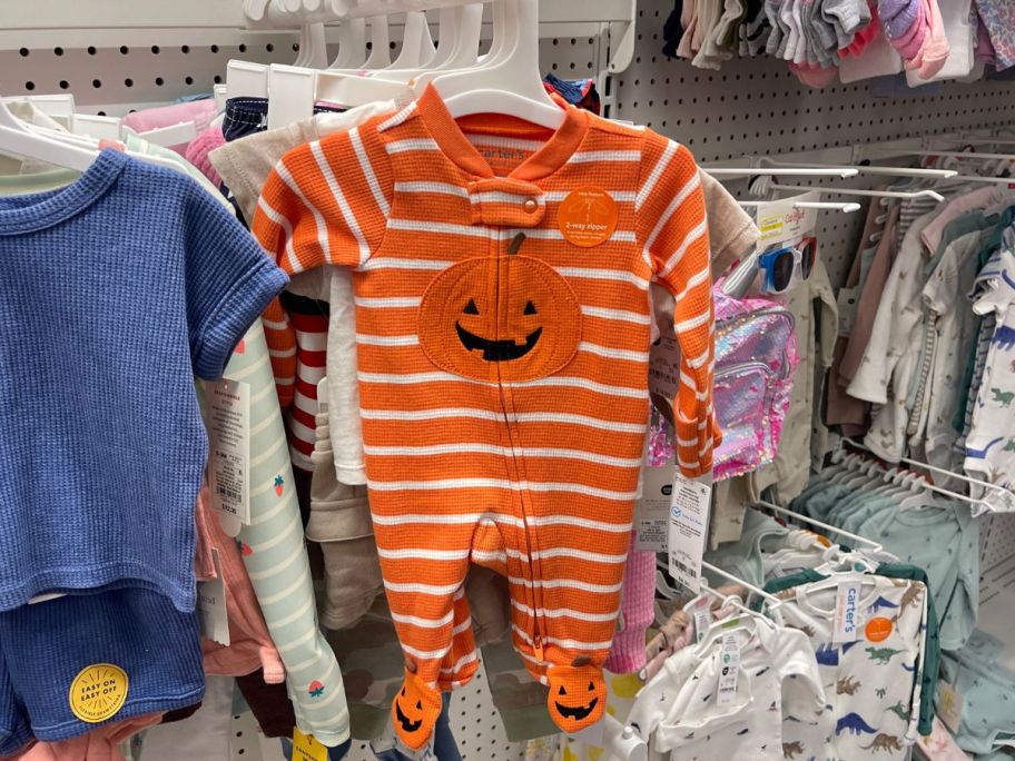 Carter's Just One You Baby Halloween Pumpkin Sleep N' Play hanging in store