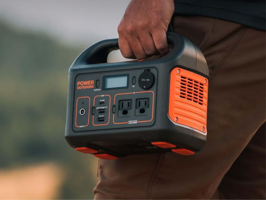 person holding Jackery Portable Power Generator Station Explorer 300