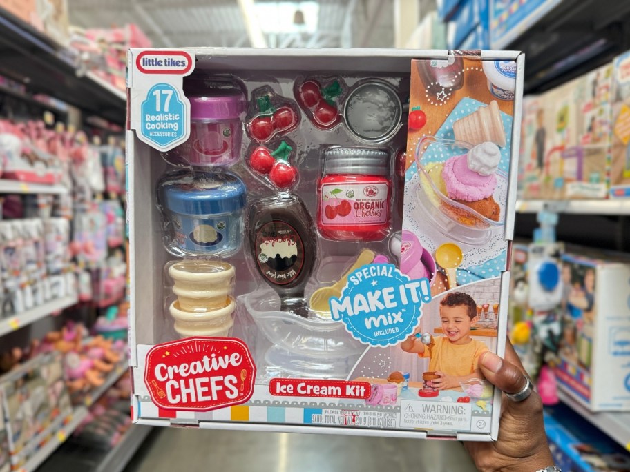 hand holding a box with a Little Tikes Creative Chefs Ice Cream Kit playset