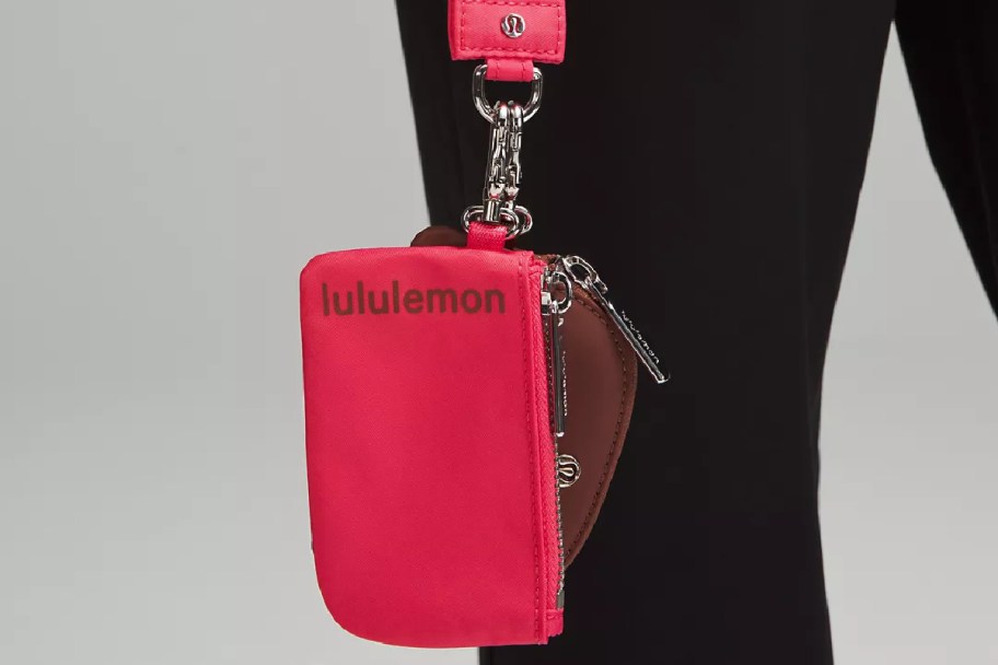 woman holding a lululemon Dual Pouch Wristlet