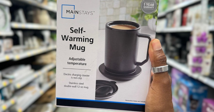 hand holding mainstays self warming coffee mug box