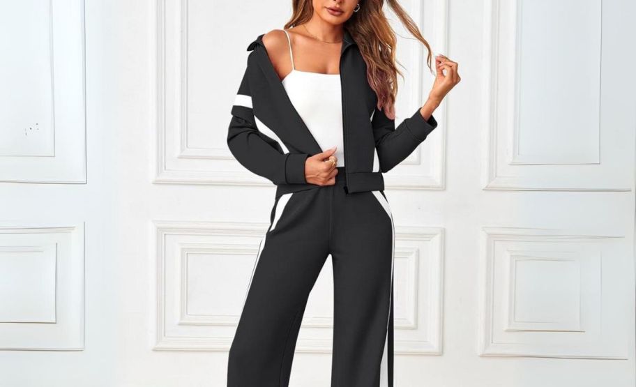 model wearing a 2 piece tracksuit set in black