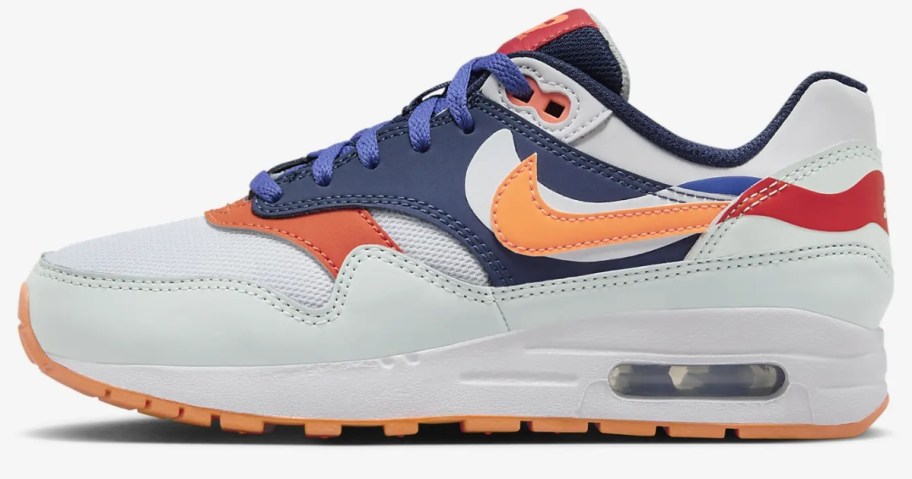 kid's Nike Air Max style shoe in white with red, blue, and bright orange accents