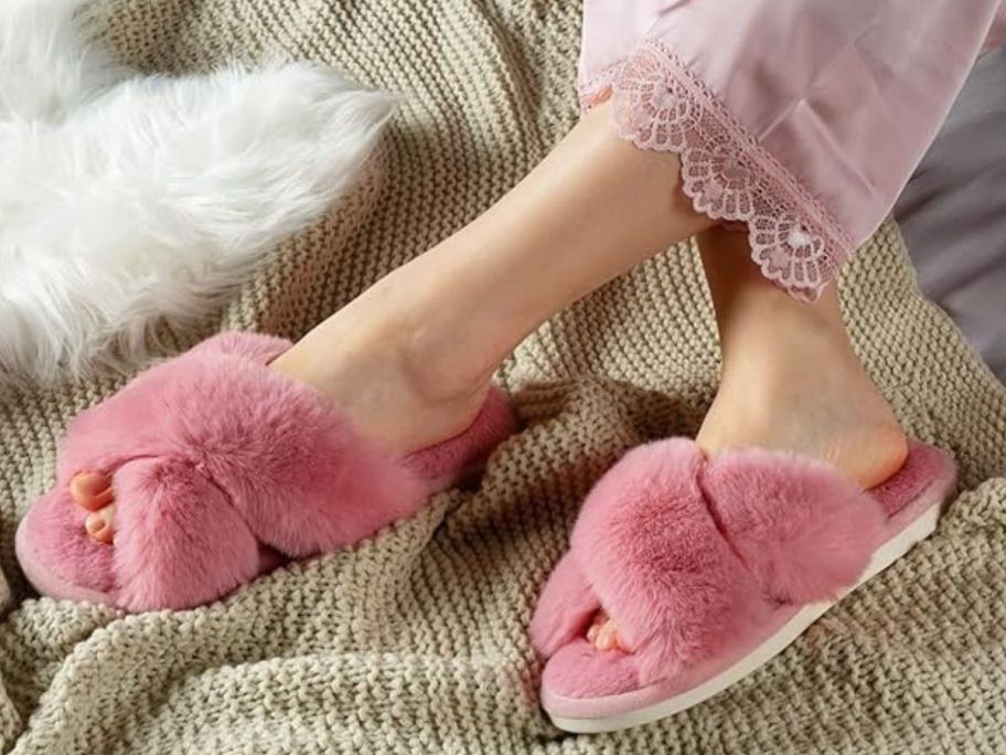 Woman's feet wearing pink parlovable slippers