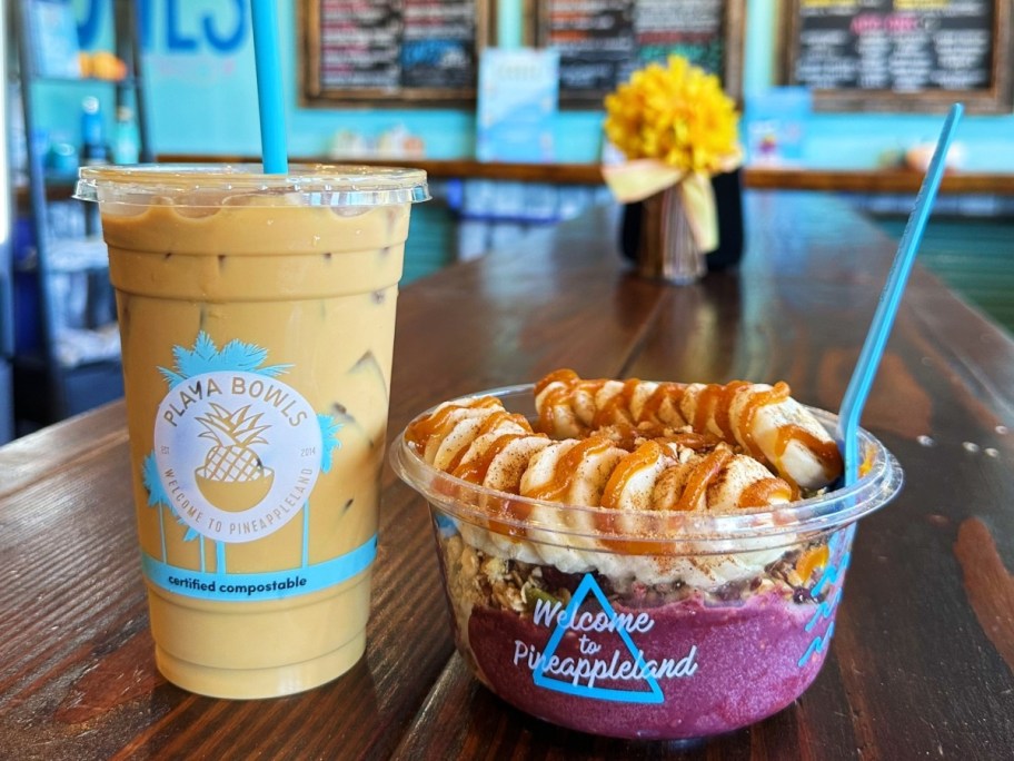 iced coffee next to an acai bowl