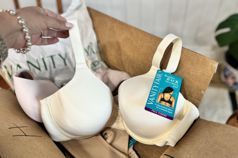 hand grabbing bra out of box