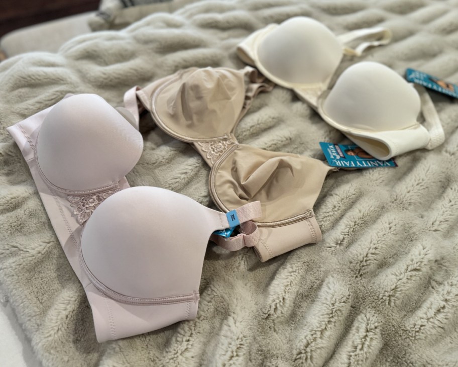 three beauty back bras on bed