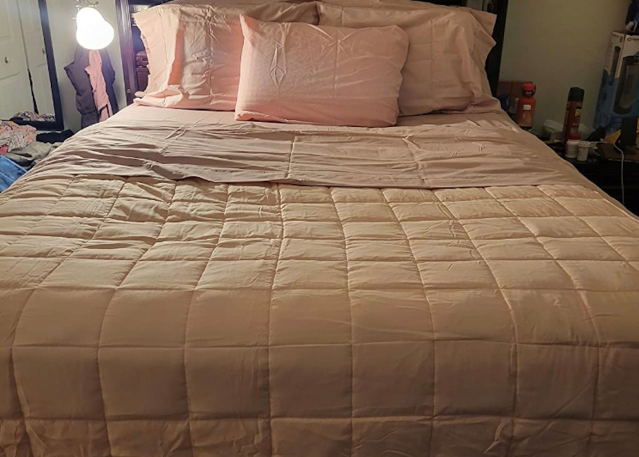 pink quilted comforter on bed