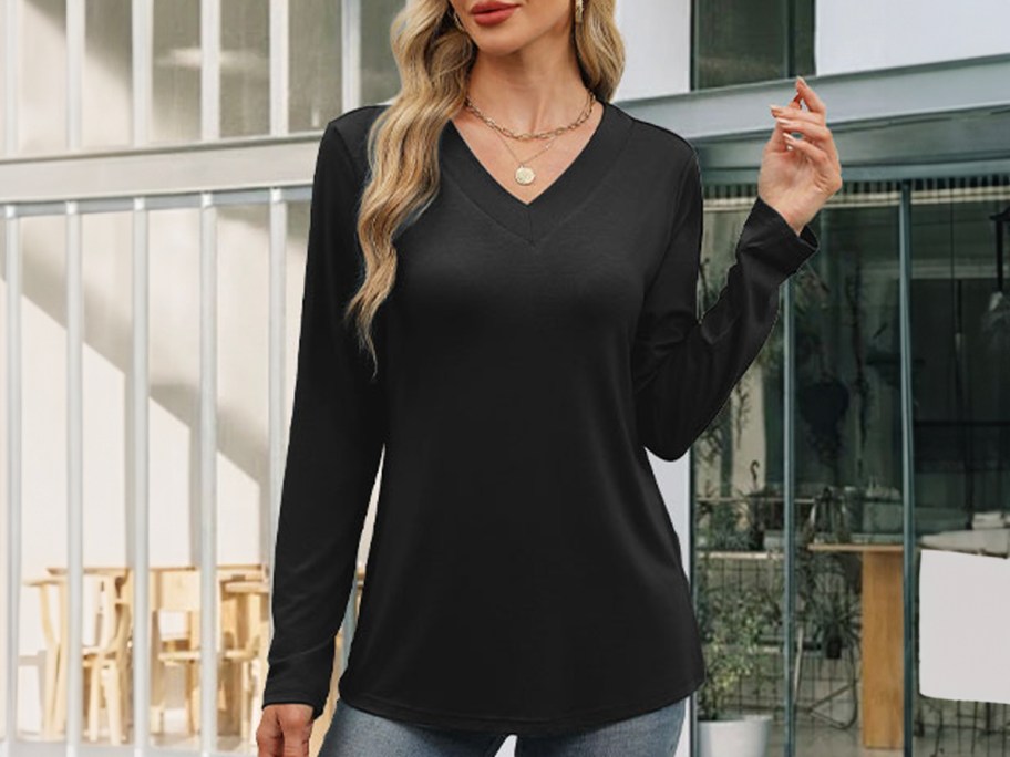 woman outside wearing black long sleeve tee 