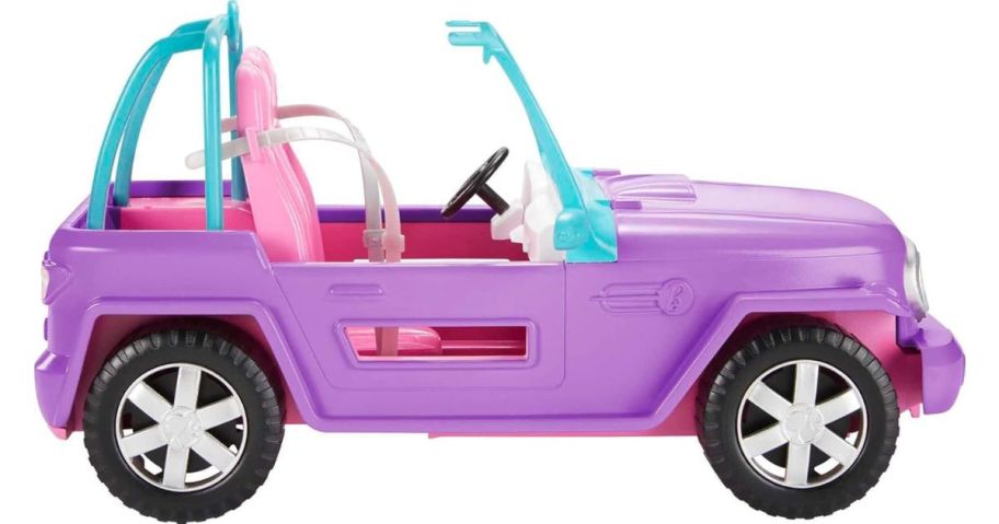 A pink Barbie Jeep Toy Car