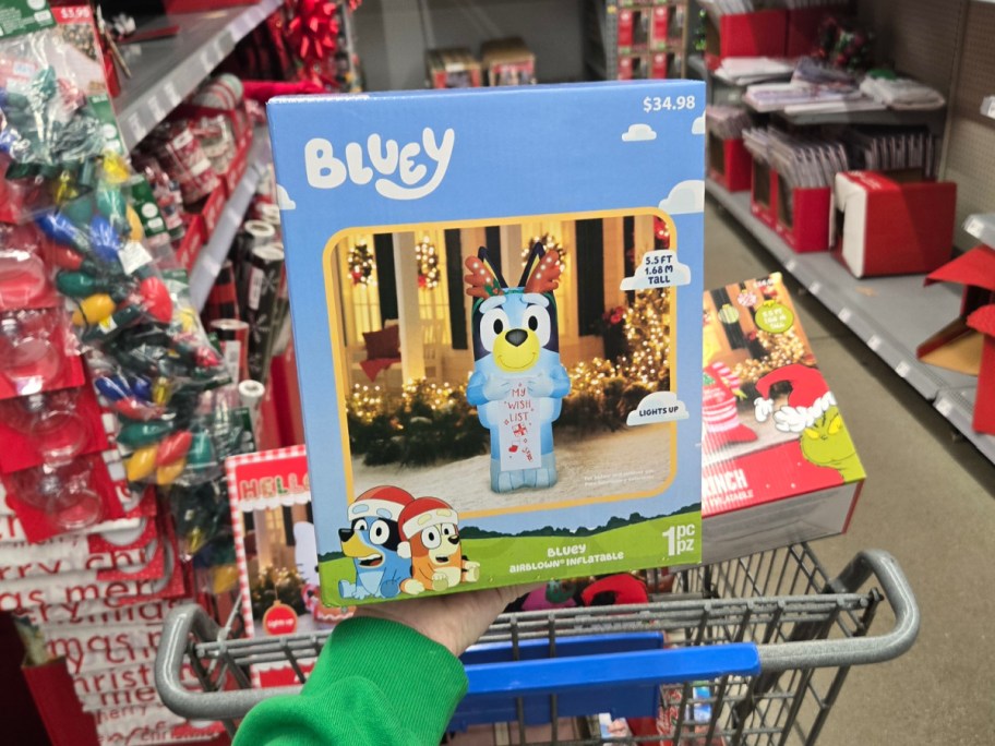 Bluey with Wishlist Christmas Inflatable in front of shopping cart