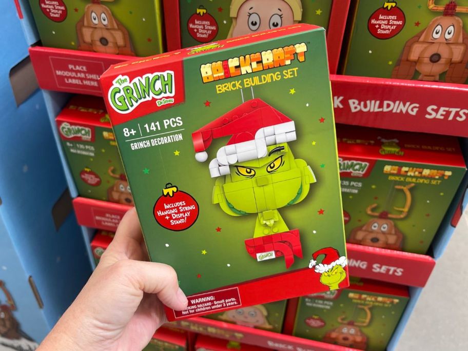 Brickcraft Grinch Ornament Brick Building Kit in hand in store