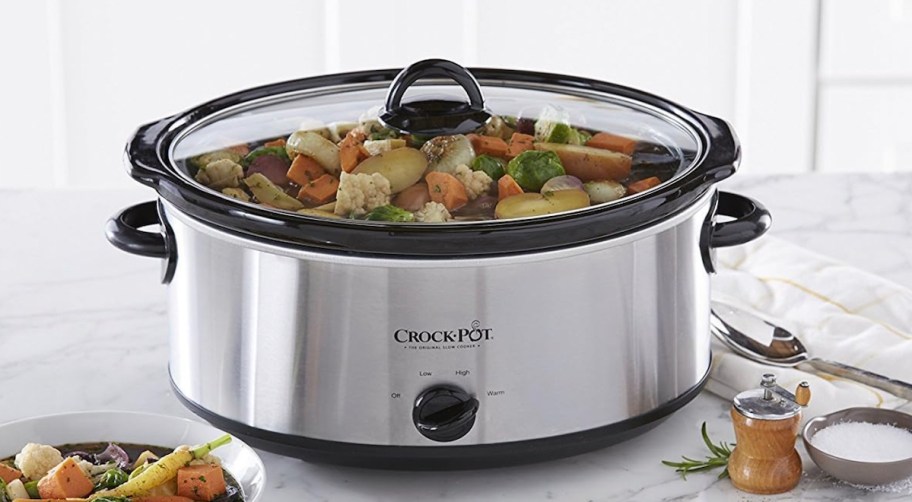 stainless steel crockpot on kitchen countertop