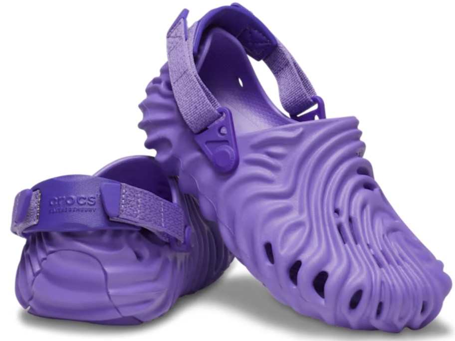 pair of purple kids Crocs clogs with a ridged, rippled, swirl type design