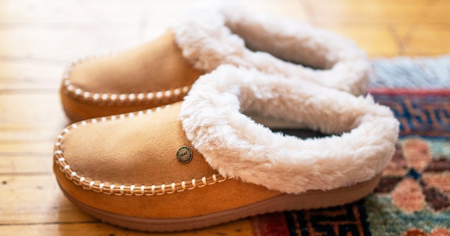 pair of brown clogs with fluff around ankles