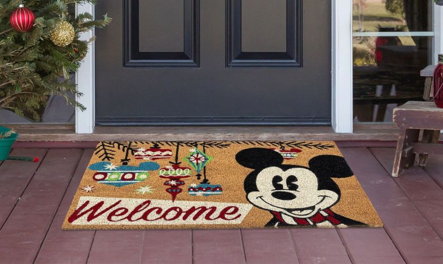 mickey mouse doormat in front of a door