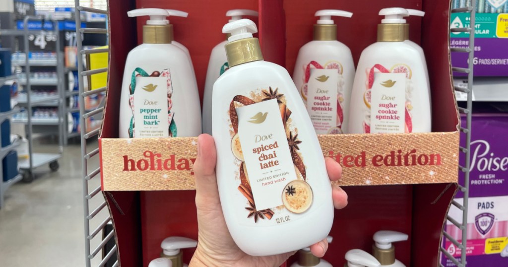 woman holding bottle of Dove Holiday hand Wash at Walmart