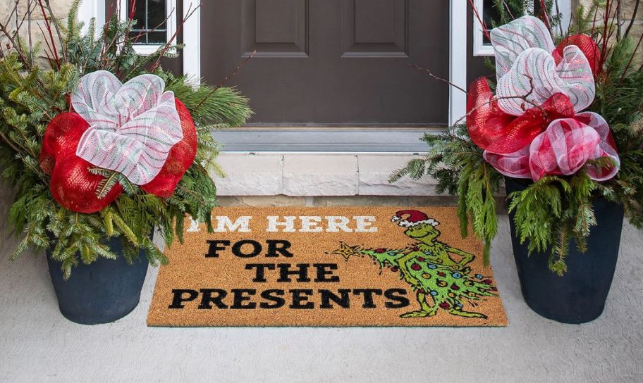 grinch doormat in front of a door