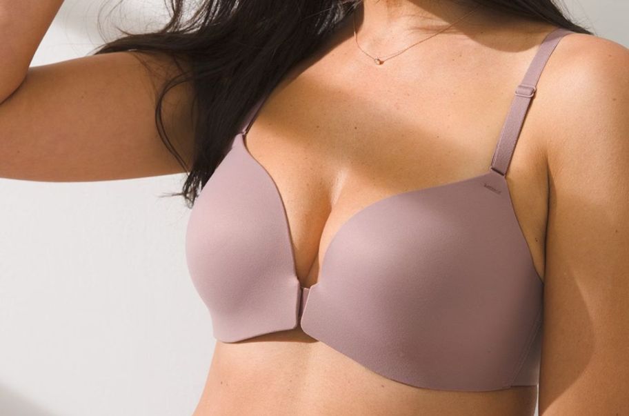 model in a front close raceback bra