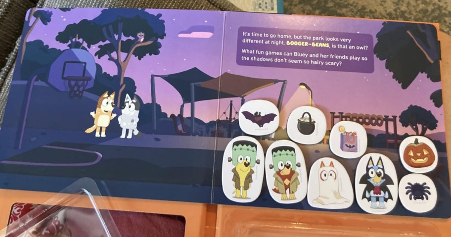 inside of a Bluey Halloween Board Book story with Bluey and Halloween themed magnets