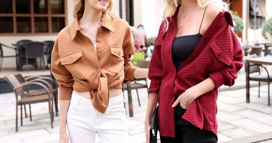 two women standing outside wearing quilted button down shackets, one in tan with it tied at the waist and one in wine red with it off one shoulder