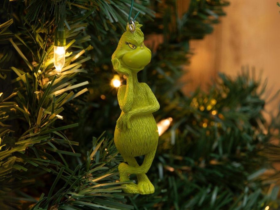 Hallmark Grinch Ornament hanging on tree